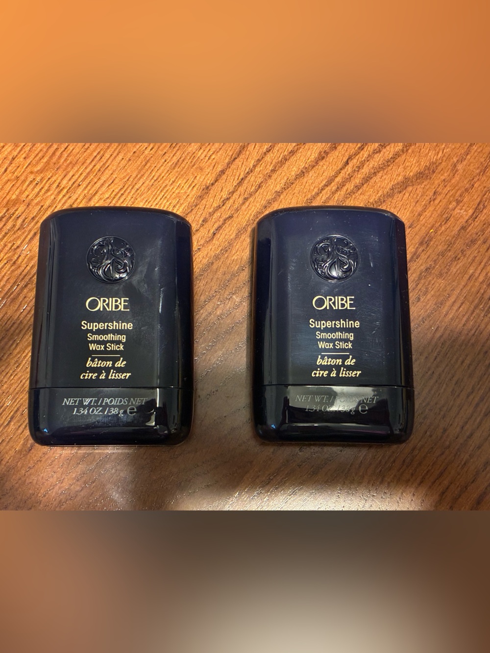 Oribe Supershine Smoothing Wax Stick — Deep Navy with Gold Accents